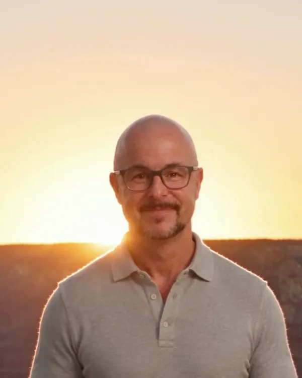 The same presenter at the Grand Canyon at sunset